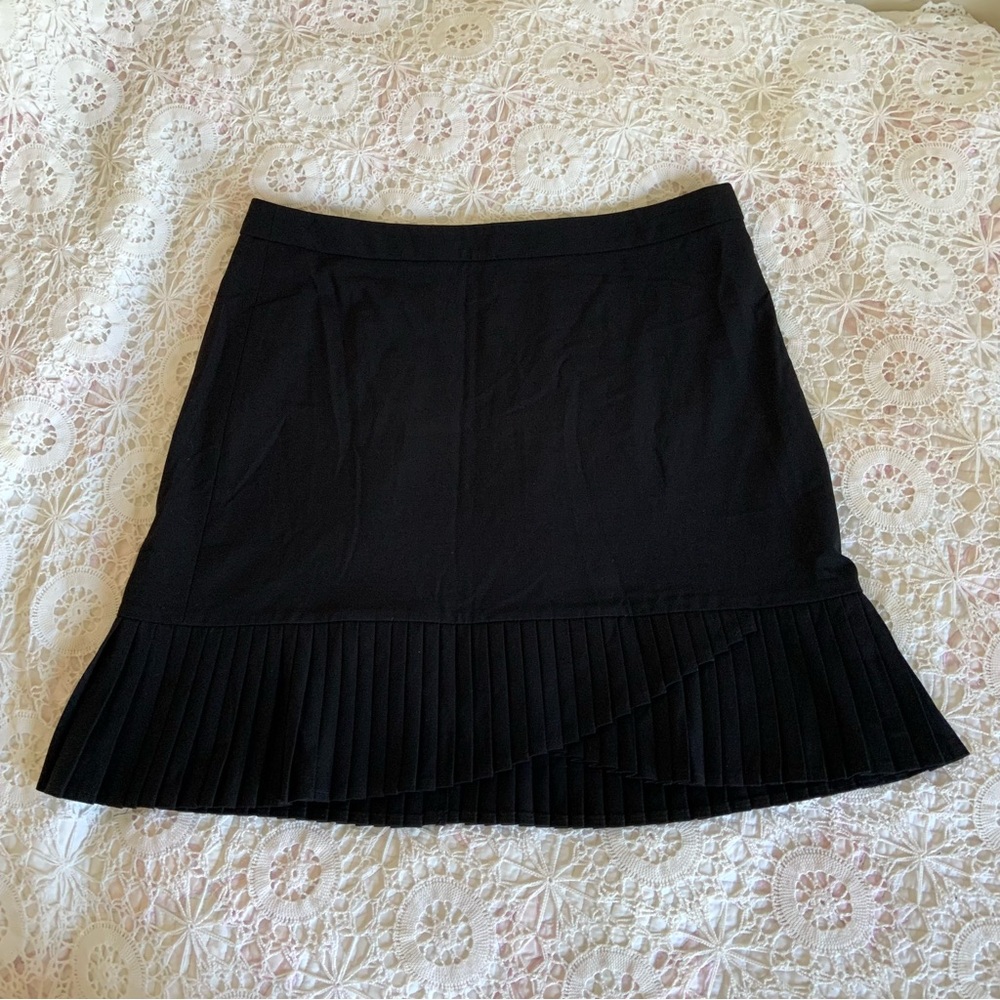 The limited black asymmetrical mini pleated skirt